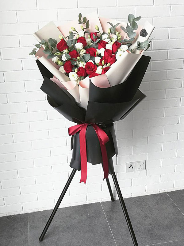 red-rose-opening-flower-stand