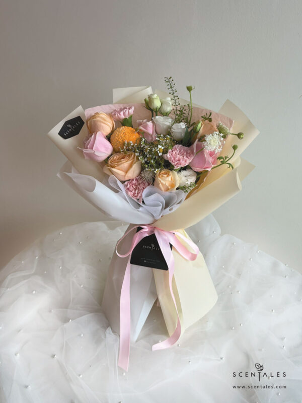 Fresh Flower Bouquet with Champagne rose, pink rose, pink carnation,ping pong, chamomile, white trachymene buds, white eustoma and plenty of thlaspi