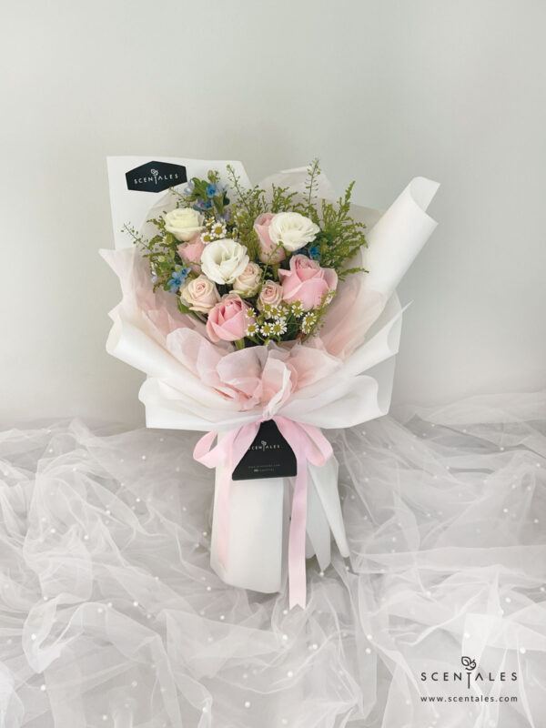 Fresh flower bouquet with Soft pink rose, champagne spray rose, white eustoma buds, blue oxypetalum, chamomile and plenty of thlaspi and yellow peacock