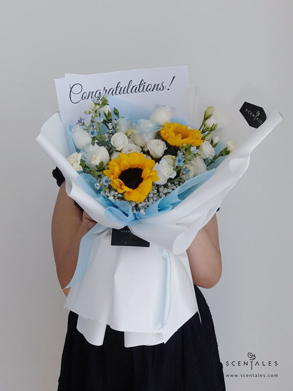 Wisdom In Bloom Fresh Flower Bouquet fresh flower bouquet with sunflower, blue rose, white eustoma, white spray carnation and blue oxypetalum
