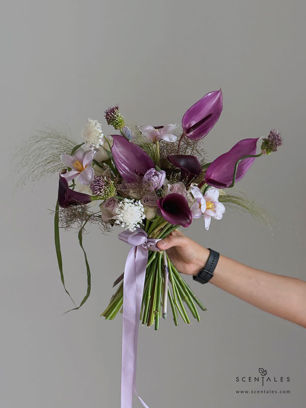 Jensine Bridal Bouquet Fresh Bridal Bouquet with violet dyed tulip, dark purple calla lily, purple anthurium, dancing allium, lilac rose, white rose, panicum, nudsedge and trachymene